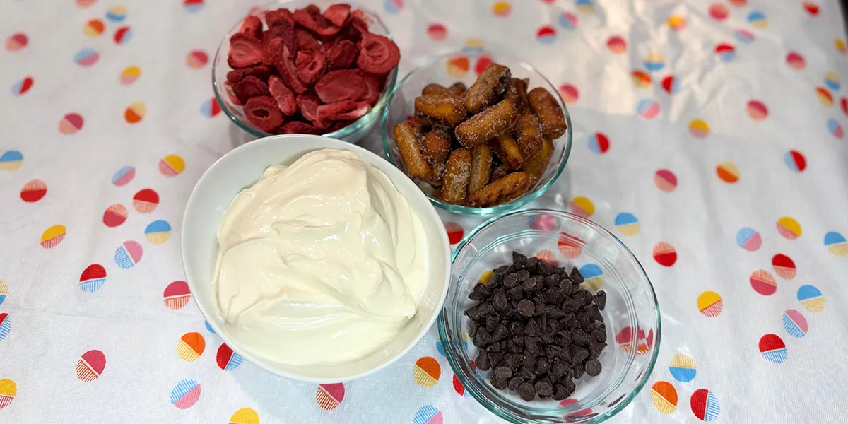 Bowls of ice cream topped with chocolate chips and sliced bananas, creating a delicious dessert display.